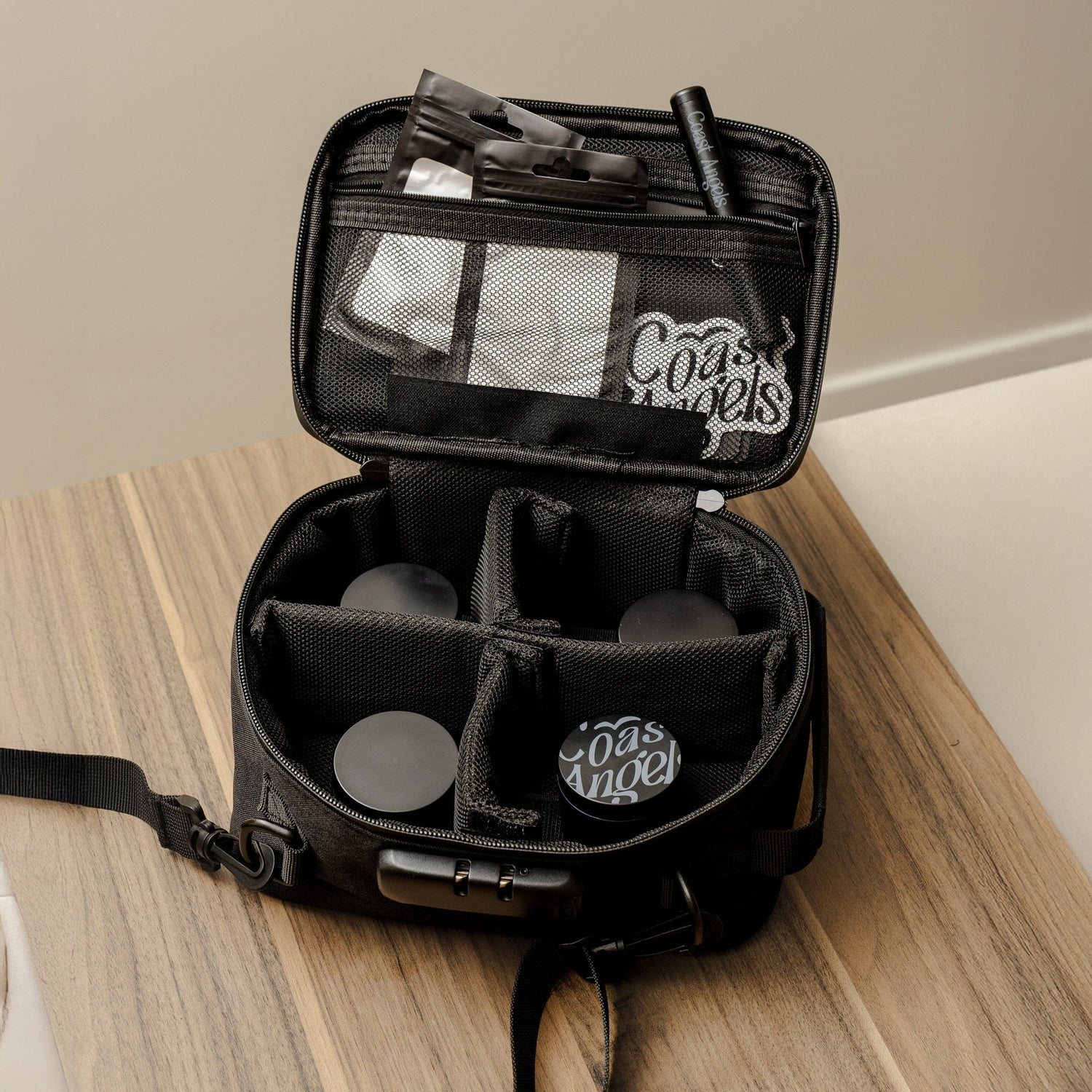 Black Coast Angels smell proof bag on a wooden surface
